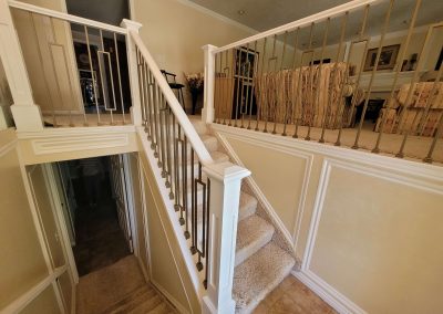 Stair railing with gold balusters