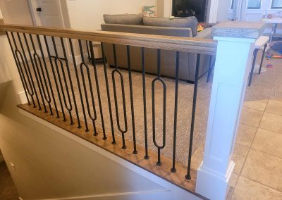modern stair railing with oval balusters
